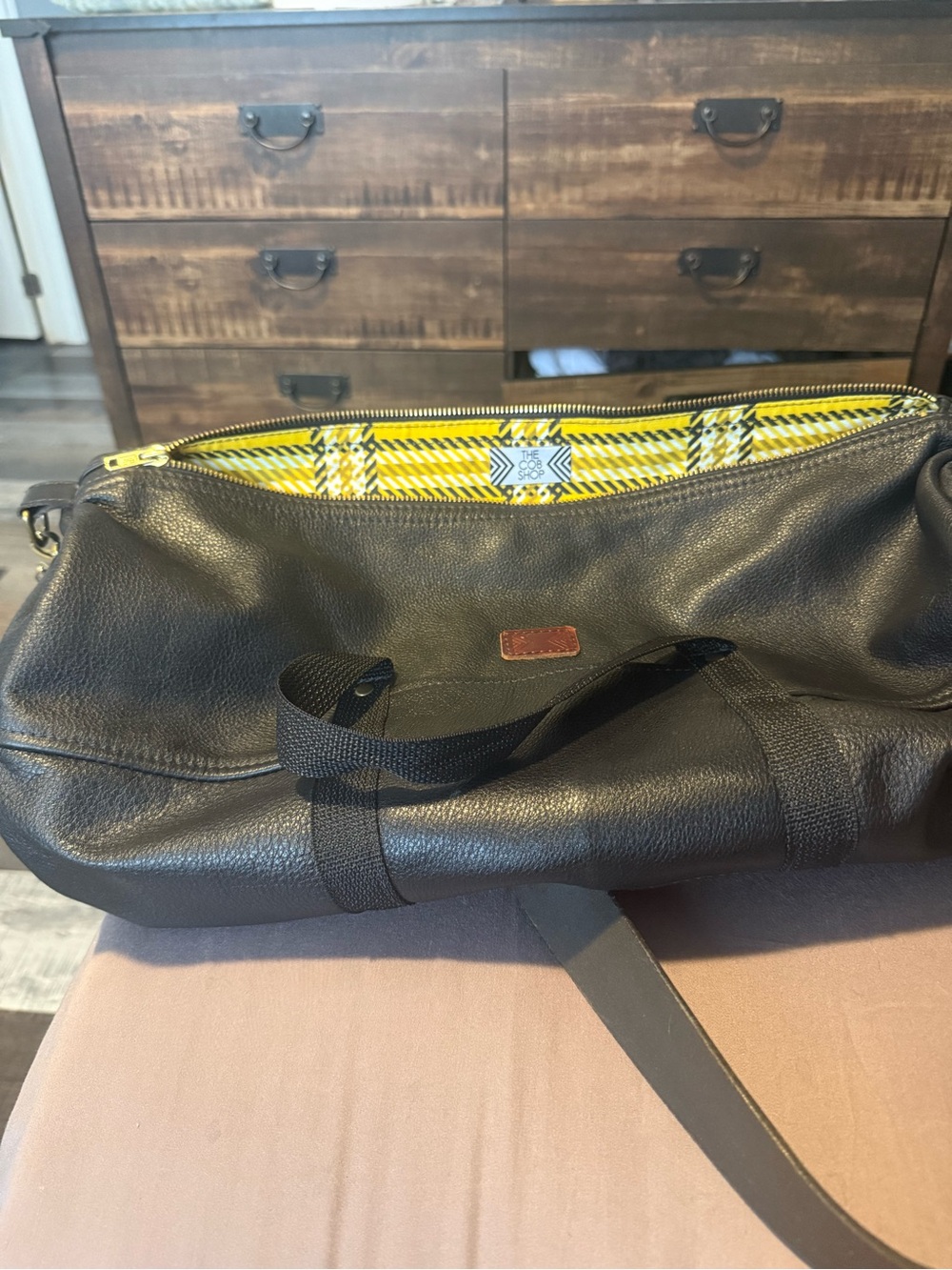 Men's Black Pebbled Leather Duffel Bag with Yellow Plaid Lining